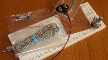 LED light intensity adjustment through two transistors